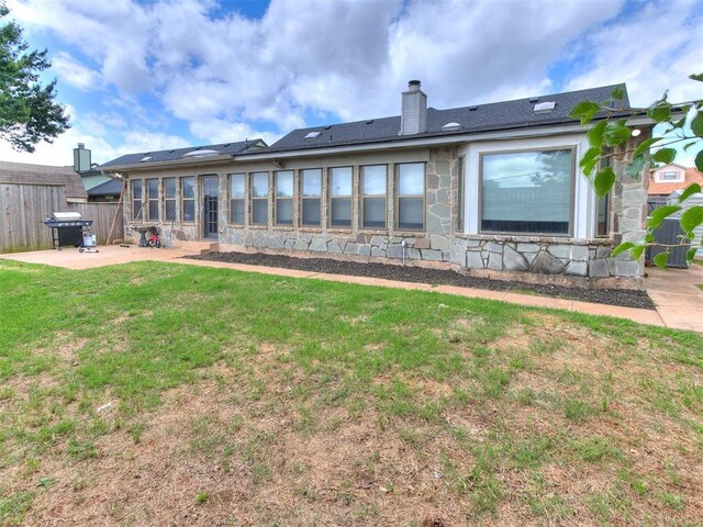 17612 Durbin Park Rd, Edmond, OK 73012 - rear view of property with a patio area, a chimney, and stone siding