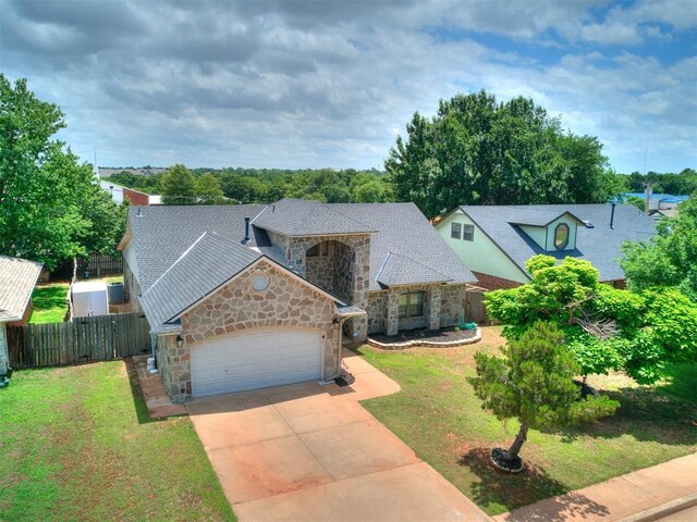 17612 Durbin Park Rd, Edmond, OK 73012 - view of front facade with stone siding, a garage, concrete driveway, and a shingled roof