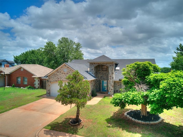 17612 Durbin Park Rd, Edmond, OK 73012 - view of front of property with stone siding, an attached garage, a front lawn, and driveway