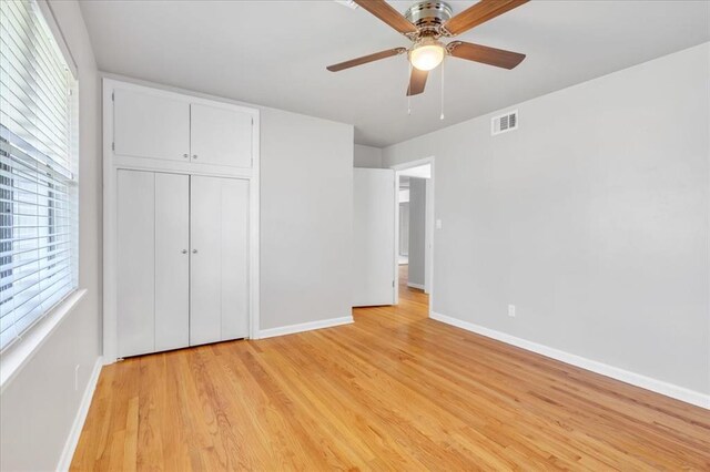 5712 N Roff Ave, Oklahoma City, OK 73112 - unfurnished bedroom with baseboards, light wood-style flooring, a closet, and a ceiling fan