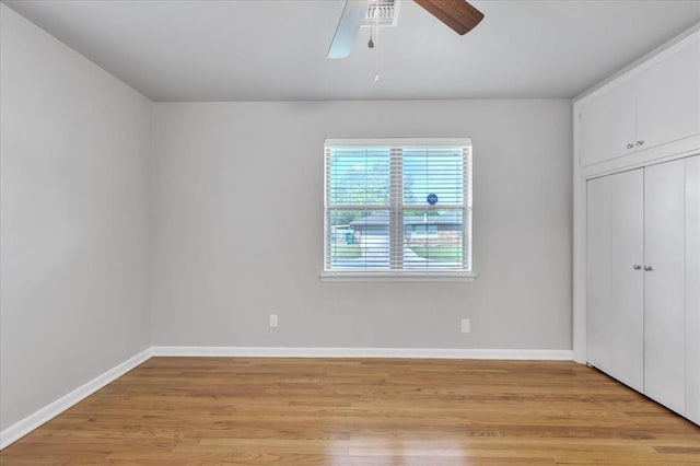 5712 N Roff Ave, Oklahoma City, OK 73112 - unfurnished bedroom featuring light wood-type flooring, baseboards, a closet, and ceiling fan