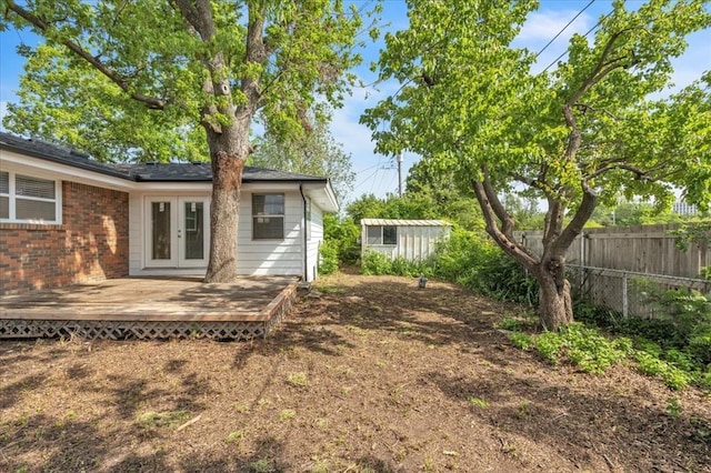 5712 N Roff Ave, Oklahoma City, OK 73112 - view of yard with french doors and a wooden deck