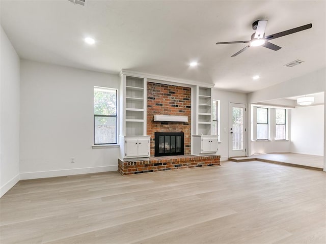 1033 Linn Ln, Yukon, OK 73099 - unfurnished living room featuring baseboards, a fireplace, light wood-style floors, a ceiling fan, and recessed lighting