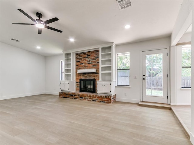 1033 Linn Ln, Yukon, OK 73099 - unfurnished living room with baseboards, light wood-style flooring, a fireplace, and recessed lighting