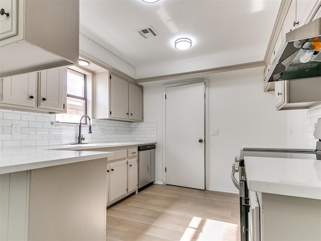 1033 Linn Ln, Yukon, OK 73099 - kitchen with dishwasher, extractor fan, electric range oven, light wood finished floors, and tasteful backsplash