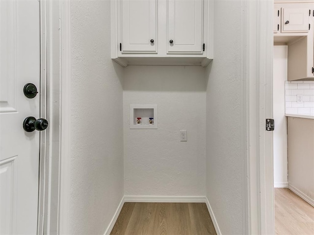 1033 Linn Ln, Yukon, OK 73099 - washroom featuring light wood-type flooring, cabinet space, baseboards, and washer hookup