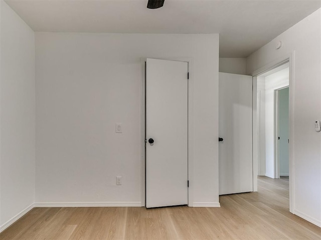 1033 Linn Ln, Yukon, OK 73099 - unfurnished bedroom featuring light wood-style floors and baseboards