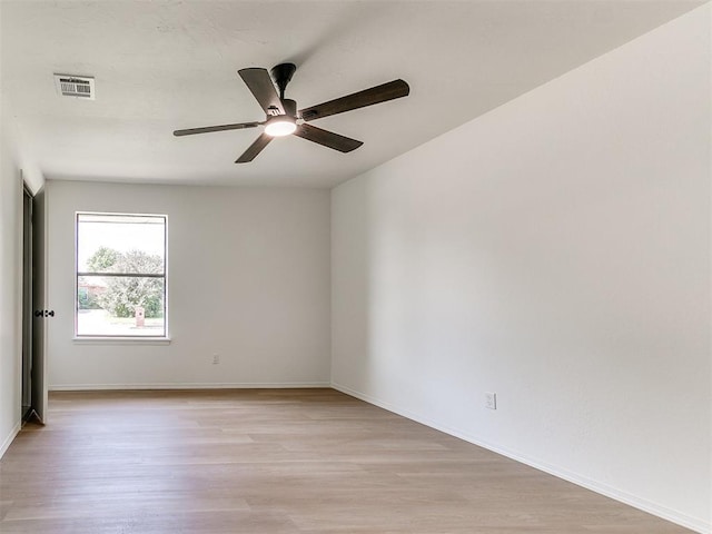 1033 Linn Ln, Yukon, OK 73099 - unfurnished room with light wood-type flooring, ceiling fan, and baseboards