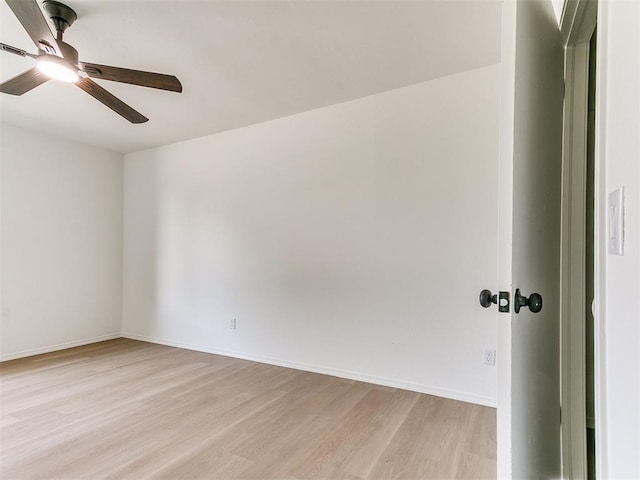 1033 Linn Ln, Yukon, OK 73099 - spare room with light wood finished floors, ceiling fan, and baseboards