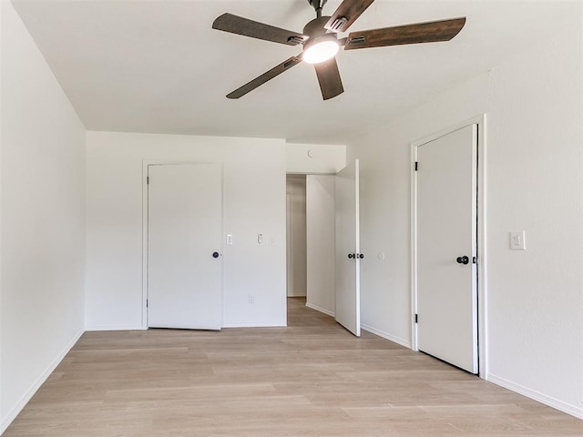 1033 Linn Ln, Yukon, OK 73099 - unfurnished bedroom featuring light wood-style floors, baseboards, and a ceiling fan
