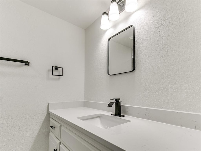 1033 Linn Ln, Yukon, OK 73099 - bathroom featuring vanity and a textured wall