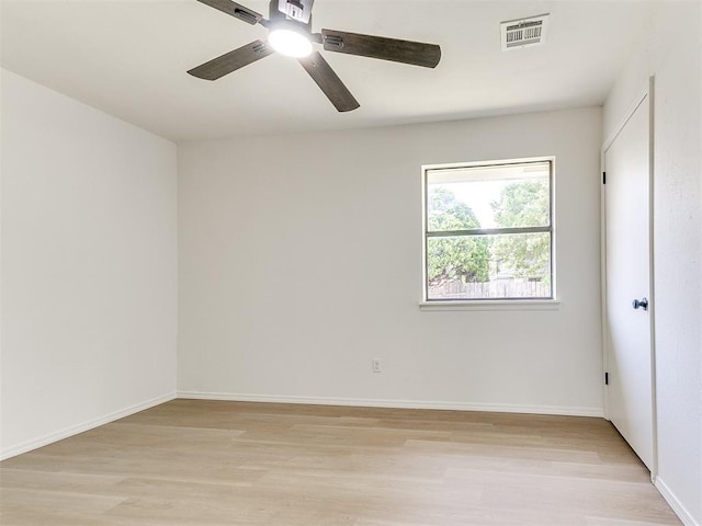 1033 Linn Ln, Yukon, OK 73099 - unfurnished room featuring light wood-style flooring, ceiling fan, and baseboards
