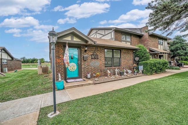 1301 Canterbury Blvd, Altus, OK 73521 - view of front of property featuring a front yard and brick siding