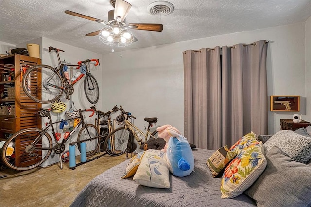 1301 Canterbury Blvd, Altus, OK 73521 - bedroom with concrete flooring, a textured ceiling, and ceiling fan