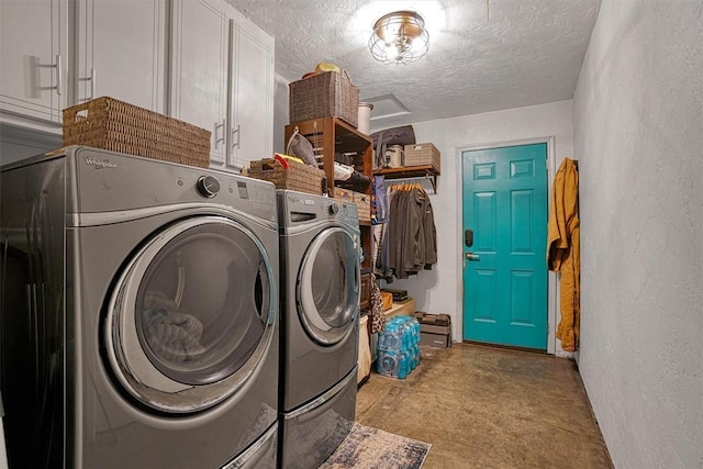 1301 Canterbury Blvd, Altus, OK 73521 - laundry room featuring cabinet space, washing machine and clothes dryer, a textured ceiling, and a textured wall