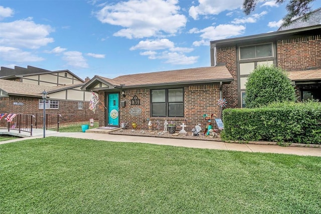 1301 Canterbury Blvd, Altus, OK 73521 - view of front of house with brick siding and roof with shingles