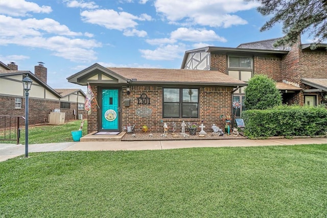 1301 Canterbury Blvd, Altus, OK 73521 - view of front facade with brick siding and a shingled roof