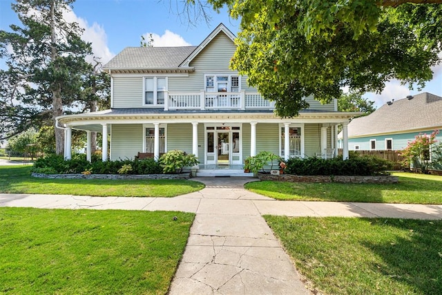 516 S Macomb Ave, El Reno, OK 73036 - view of front of house featuring covered porch and a front yard