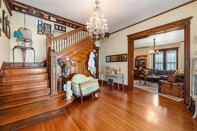 516 S Macomb Ave, El Reno, OK 73036 - staircase with a chandelier, wood finished floors, baseboards, and ornamental molding