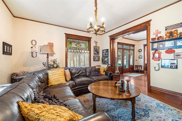 516 S Macomb Ave, El Reno, OK 73036 - living room with a chandelier, ornamental molding, wood finished floors, french doors, and baseboards