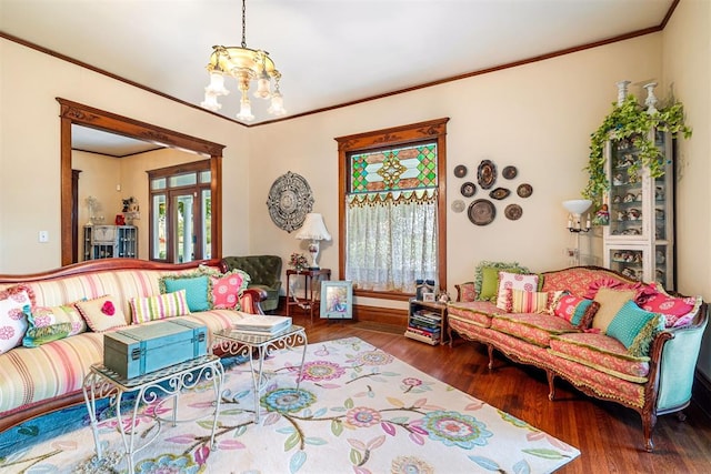 516 S Macomb Ave, El Reno, OK 73036 - living area featuring wood finished floors, a chandelier, crown molding, and baseboards