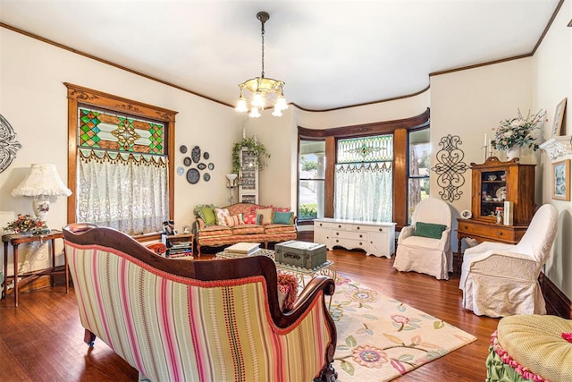 516 S Macomb Ave, El Reno, OK 73036 - living room featuring a chandelier, ornamental molding, and wood finished floors