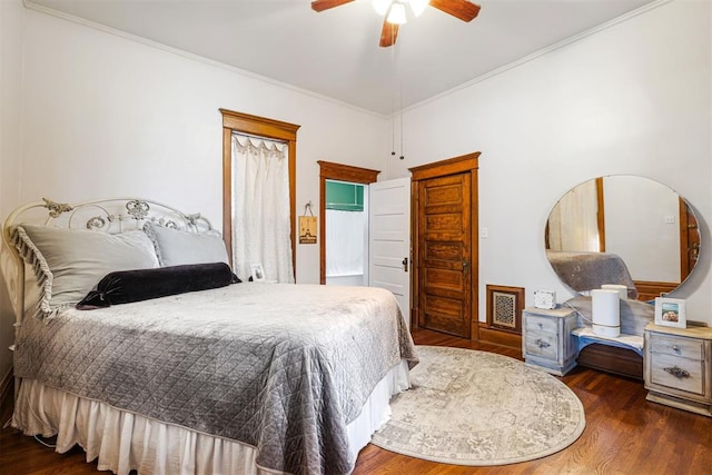 516 S Macomb Ave, El Reno, OK 73036 - bedroom featuring wood finished floors, crown molding, ceiling fan, and baseboards