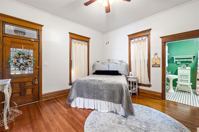 516 S Macomb Ave, El Reno, OK 73036 - bedroom featuring wood finished floors, baseboards, a ceiling fan, and ornamental molding
