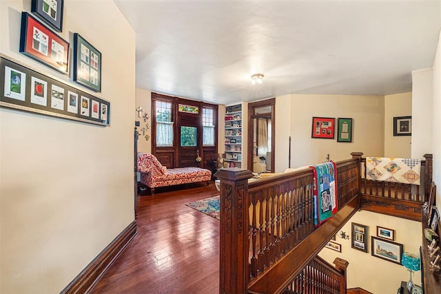 516 S Macomb Ave, El Reno, OK 73036 - corridor with an upstairs landing, hardwood / wood-style flooring, and baseboards