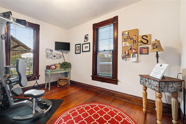 516 S Macomb Ave, El Reno, OK 73036 - living area with baseboards and hardwood / wood-style flooring