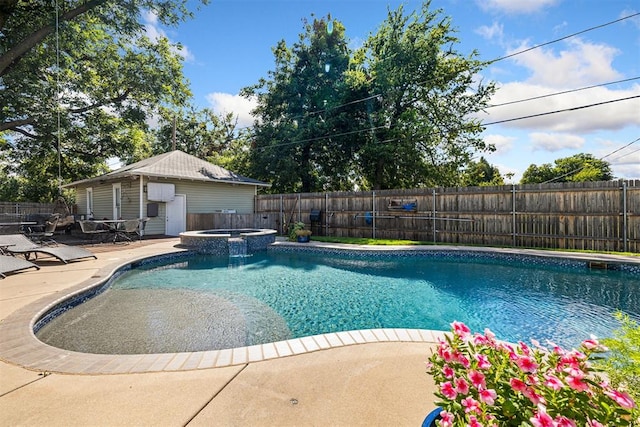 516 S Macomb Ave, El Reno, OK 73036 - view of swimming pool featuring a fenced backyard, an outdoor structure, a patio area, and a pool with connected hot tub
