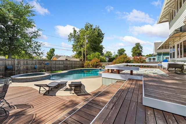 516 S Macomb Ave, El Reno, OK 73036 - view of pool featuring a deck, a fenced backyard, and a pool with connected hot tub