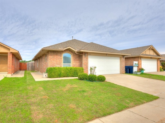 5805 Marblewood Dr, Oklahoma City, OK 73179 - single story home with a garage, brick siding, driveway, and roof with shingles