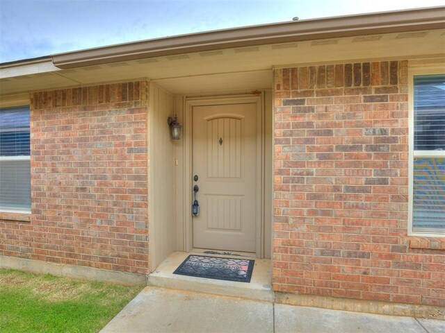 5805 Marblewood Dr, Oklahoma City, OK 73179 - view of exterior entry featuring brick siding