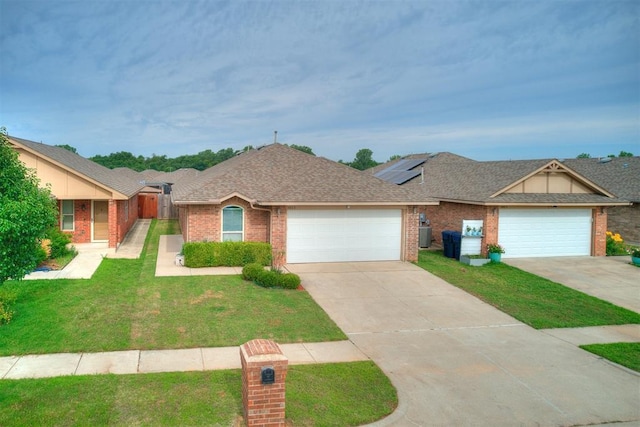 5805 Marblewood Dr, Oklahoma City, OK 73179 - ranch-style house with brick siding, a garage, concrete driveway, a front lawn, and a shingled roof