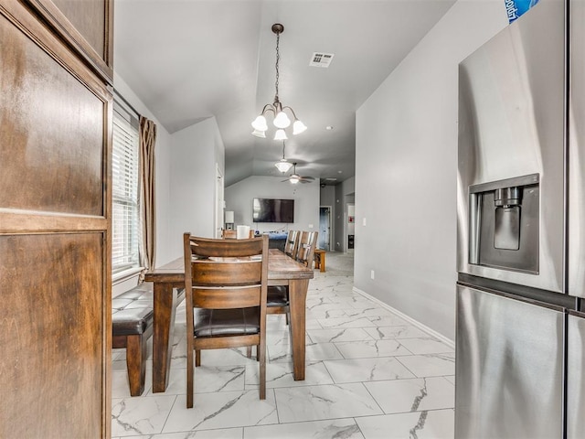 5805 Marblewood Dr, Oklahoma City, OK 73179 - dining area featuring light marble finish flooring, a chandelier, and a ceiling fan