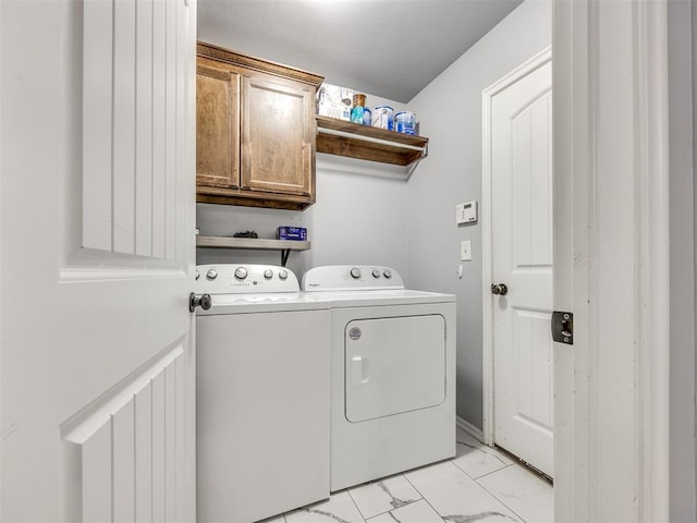 5805 Marblewood Dr, Oklahoma City, OK 73179 - laundry room featuring cabinet space, washing machine and dryer, and light marble finish flooring