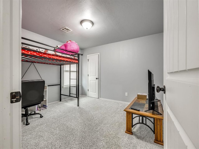 5805 Marblewood Dr, Oklahoma City, OK 73179 - carpeted bedroom featuring an office area and a textured ceiling