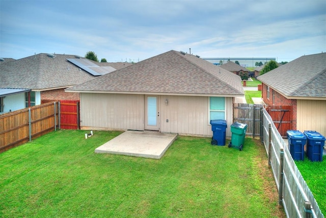 5805 Marblewood Dr, Oklahoma City, OK 73179 - rear view of house featuring a patio, roof with shingles, and a fenced backyard