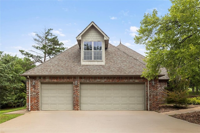 6373 Stone Valley Dr, Edmond, OK 73034 - view of front of house with brick siding, a shingled roof, and driveway
