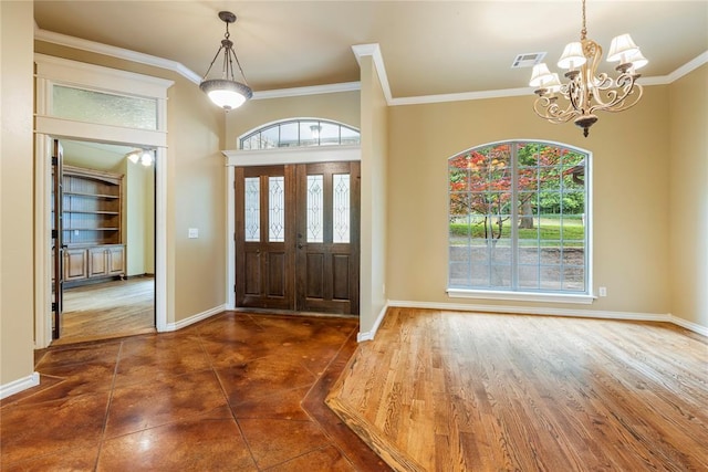 6373 Stone Valley Dr, Edmond, OK 73034 - foyer featuring a chandelier, healthy amount of natural light, ornamental molding, and baseboards