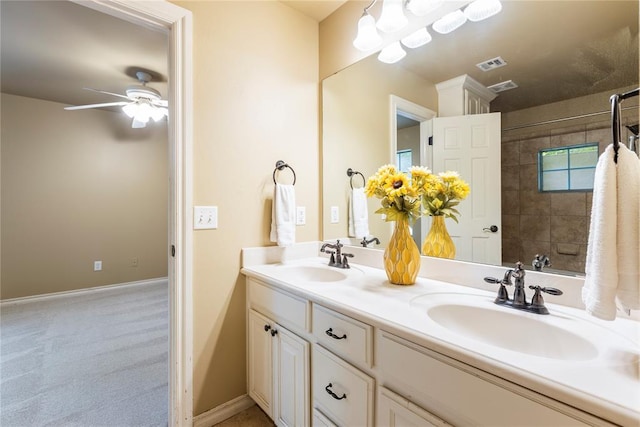 6373 Stone Valley Dr, Edmond, OK 73034 - full bath with double vanity, a ceiling fan, a shower, and baseboards
