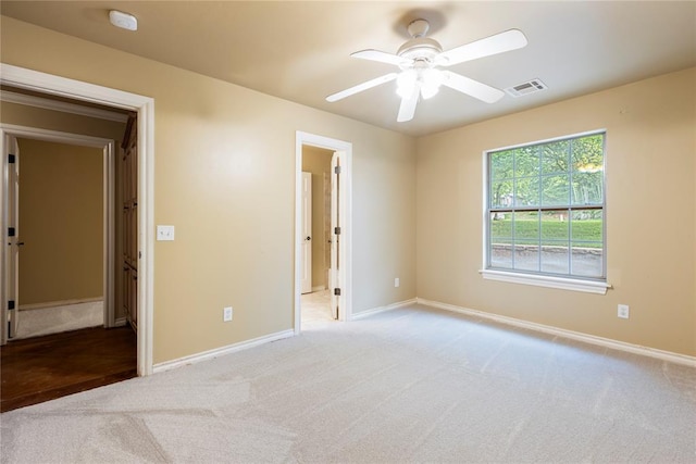 6373 Stone Valley Dr, Edmond, OK 73034 - unfurnished bedroom featuring carpet, baseboards, and ceiling fan