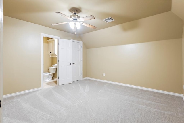 6373 Stone Valley Dr, Edmond, OK 73034 - additional living space with light colored carpet, a ceiling fan, lofted ceiling, and baseboards