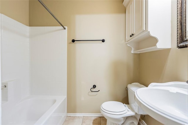 6373 Stone Valley Dr, Edmond, OK 73034 - full bathroom featuring toilet, tile patterned floors, shower / bath combination, baseboards, and a sink
