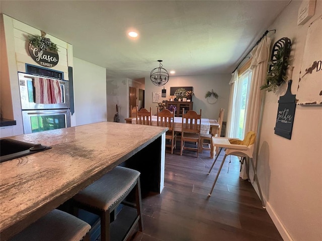 513 E Monroe St, Maud, OK 74854 - kitchen featuring stainless steel double oven, a chandelier, recessed lighting, dark wood finished floors, and hanging light fixtures