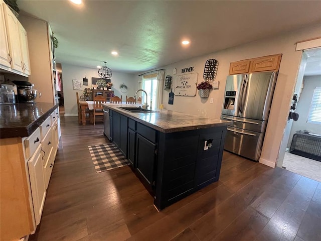 513 E Monroe St, Maud, OK 74854 - kitchen featuring appliances with stainless steel finishes, a sink, recessed lighting, dark countertops, and dark wood-type flooring