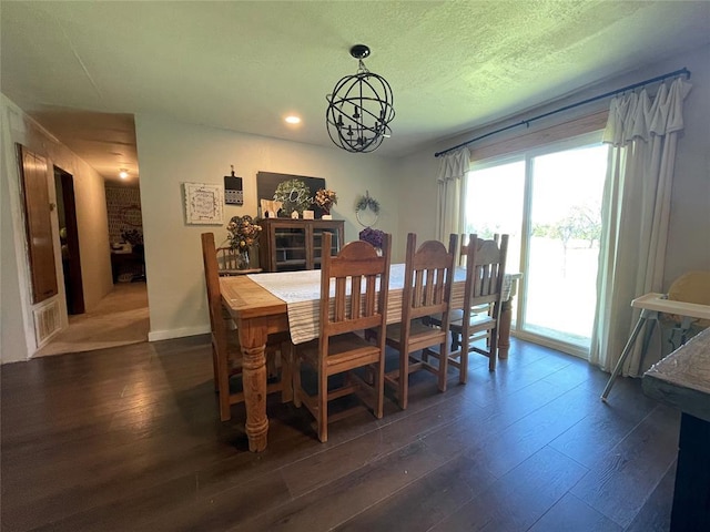513 E Monroe St, Maud, OK 74854 - dining room featuring dark wood finished floors, a chandelier, and recessed lighting