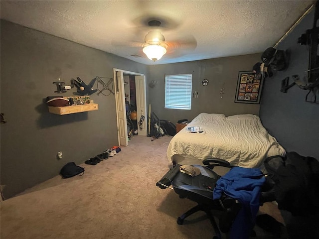 513 E Monroe St, Maud, OK 74854 - bedroom featuring carpet, a textured ceiling, and a ceiling fan