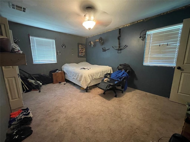 513 E Monroe St, Maud, OK 74854 - bedroom with carpet floors and a ceiling fan
